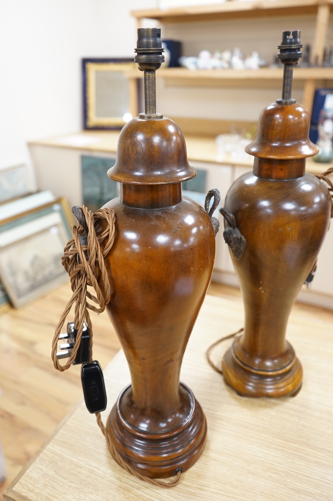 A pair of turned mahogany lamp bases - without shades H 60cm x W 18